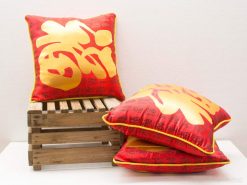 Vibrant red Chinese decorative pillows with golden accents, perfect for festive and cozy interiors.