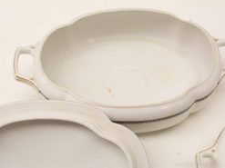 Elegant oval porcelain serving dishes with gold accents, perfect for special occasions and family meals.