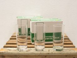 Elegant long drink glasses on rustic wood, perfect for gatherings and social occasions.