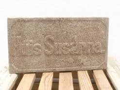 Huis Susanna antique stone block, rustic decor with faded inscription and historical charm.