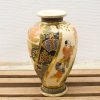 Elegant vintage ceramic vase with colorful figures, perfect for adding cultural flair to your decor.