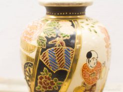 Antique Chinese vase with intricate floral designs and figures, perfect for display or collection.