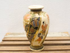 Elegant vintage ceramic vase with colorful figures, perfect for adding cultural flair to your decor.