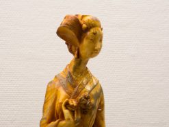 Elegant Eastern female figurine with intricate details, celebrating cultural heritage and craftsmanship.