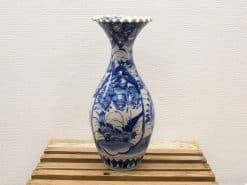 Elegant blue and white porcelain vase with intricate floral designs, perfect for any decor.