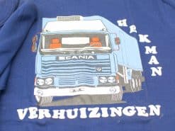 Cartoon truck t-shirt featuring HAKMAN Verhuizingen design for transport enthusiasts.