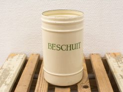 Vintage cream canister for storing hard biscuits, featuring elegant green lettering and rustic charm.