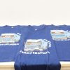 Vintage blue t-shirts with playful truck design, ideal for moving services and casual wear.