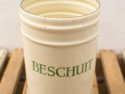 Vintage cream beschuit container with green lettering, perfect for nostalgic kitchen decor.