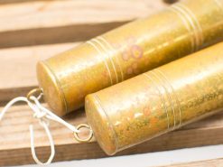 Vintage brass cylinders connected by string, showcasing unique patina and artistic craftsmanship.