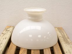 Elegant white ceramic bowl on rustic wood, showcasing sleek design and timeless charm.