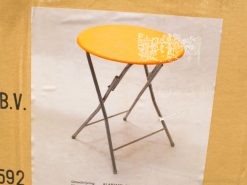 Bright orange folding table with metal legs, ideal for indoor gatherings and compact spaces.