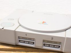 Classic Sony PlayStation 1 console, a retro gaming icon with sleek design and memory card slots.