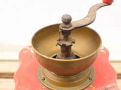 Vintage manual coffee grinder with wood accents, perfect for coffee enthusiasts and stylish kitchens.