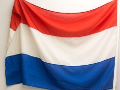 Vibrant Dutch flag with red, white, and blue horizontal stripes showcasing national pride.