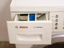 Modern Bosch washing machine with efficient detergent drawer and user-friendly controls for easy laundry.