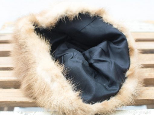 Cozy faux fur hat with satin lining, perfect for stylish warmth on cold days.