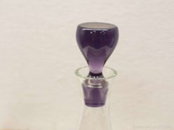 Elegant purple glass decanter with clear base, perfect for wine or decorative display.