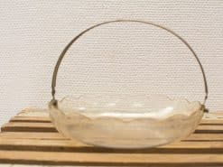 Elegant vintage glass basket with engraved design and a sleek metallic handle.