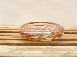 Elegant handblown glass bowl in amber and white, perfect for decor or daily use.