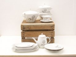 Elegant vintage porcelain dishware set with floral designs, perfect for any dining occasion.