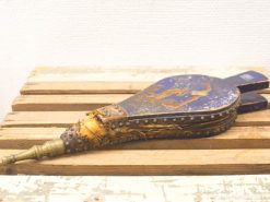 Vintage blue and gold bellows, an elegant tool showcasing artisanal craftsmanship and historical charm.