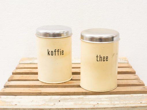 Charming vintage coffee and tea containers for a cozy kitchen ambiance.