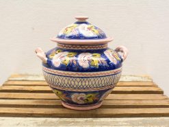 Elegant blue ceramic pot with floral designs and pink accents, perfect for decor and storage.