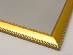 Elegant gold mirror with detailed frame design, perfect for enhancing any living space.