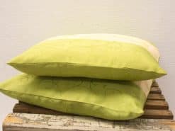 Stylish beige and green decorative pillows adding elegance to your cozy home decor.