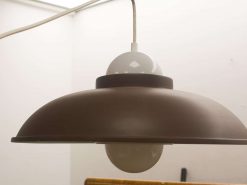 Contemporary brown pendant light fixture for modern interiors, ideal for dining rooms and kitchens.