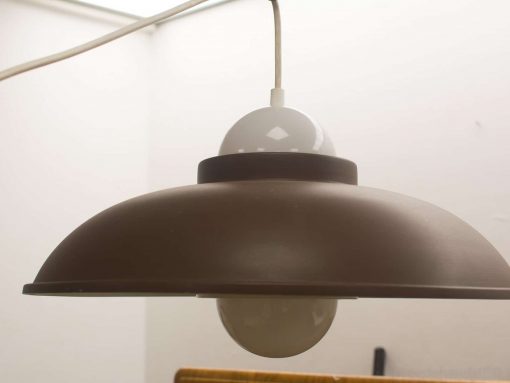 Contemporary brown pendant light fixture for modern interiors, ideal for dining rooms and kitchens.