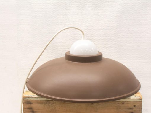 Elegant brown vintage lamp with a contrasting white dome, perfect for stylish interiors.