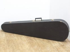 Sleek black instrument case for guitars and violins, designed for durability and transport.