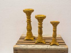 Elegant gold candle holders set with intricate designs, perfect for enhancing any decor.