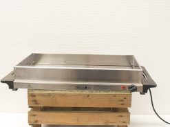 Stainless steel electric grill on wooden base, perfect for outdoor barbecues and gatherings.