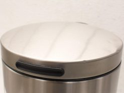 Sleek stainless steel trash can with round lid and rubber grips for easy handling.