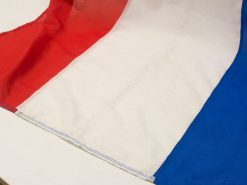 Vibrant tricolor flag in red, white, and blue, ideal for decor or patriotic displays.