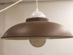 Vintage brown pendant light with a bell shape and white cord, perfect for cozy interiors.