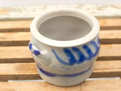 Handcrafted ceramic pot with blue patterns, perfect for decoration or serving food.