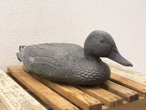 Vintage metal duck sculpture, beautifully crafted for rustic home decor and collectors display.