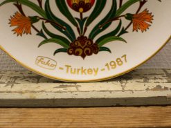 Vibrant Turkish floral plate, handcrafted in 1987, showcasing traditional artistry and elegant design.