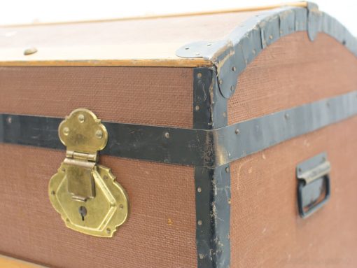 Vintage trunk with brass lock, perfect for storage and stylish home decor.