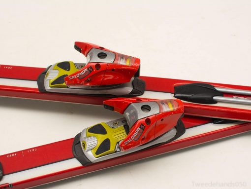 High-performance Salomon red skis with stylish bindings for skiing enthusiasts.