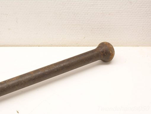 Vintage iron tool with rustic charm, showcasing history and craftsmanship in its design.