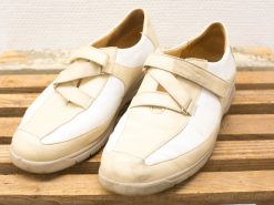 Unique beige leather sneakers with Velcro straps for casual style and comfort.