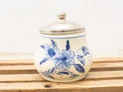 Elegant ceramic jar with blue floral design and silver lid, perfect for spices or sugar.