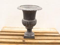 Elegant vintage urn with ribbed design, perfect for indoor or outdoor décor.