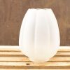 Elegant frosted glass lamp with flower design, perfect for modern or vintage interiors.