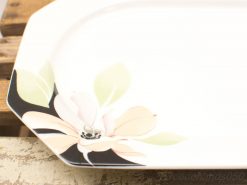 Elegant ceramic platter with hand-painted floral design, perfect for serving or decoration.